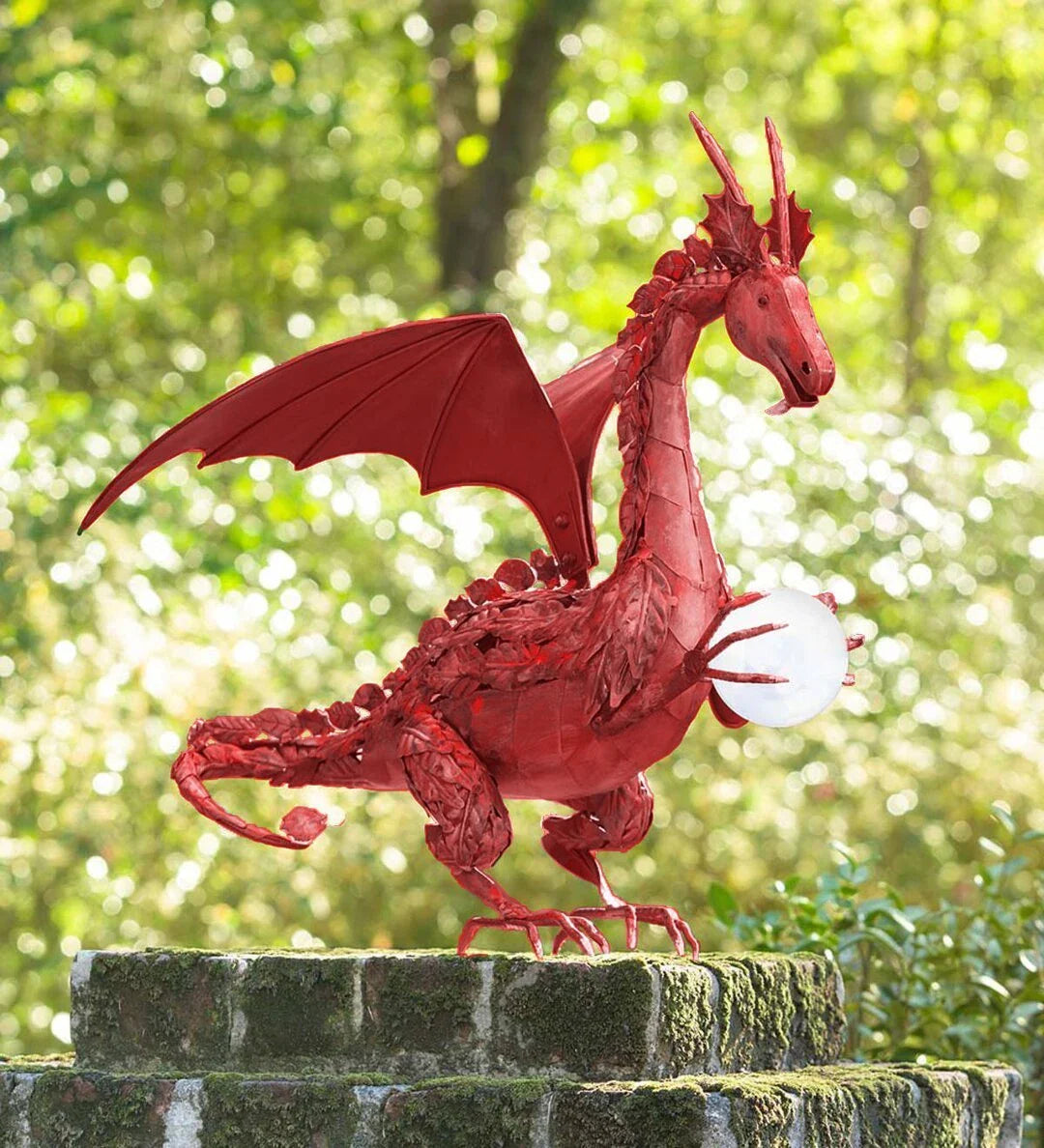 Enchanting green dragon garden statue with serene expression and solar-powered illuminating orb