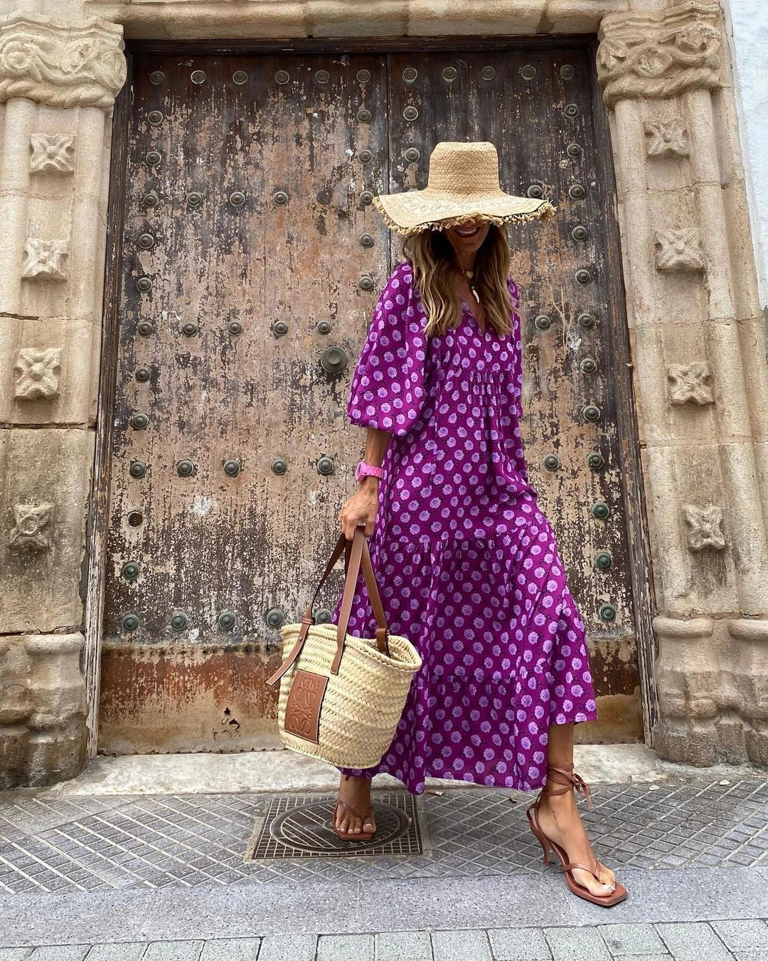 A bohemian-inspired floral midi dress in a variety of vibrant colors for the perfect summer look