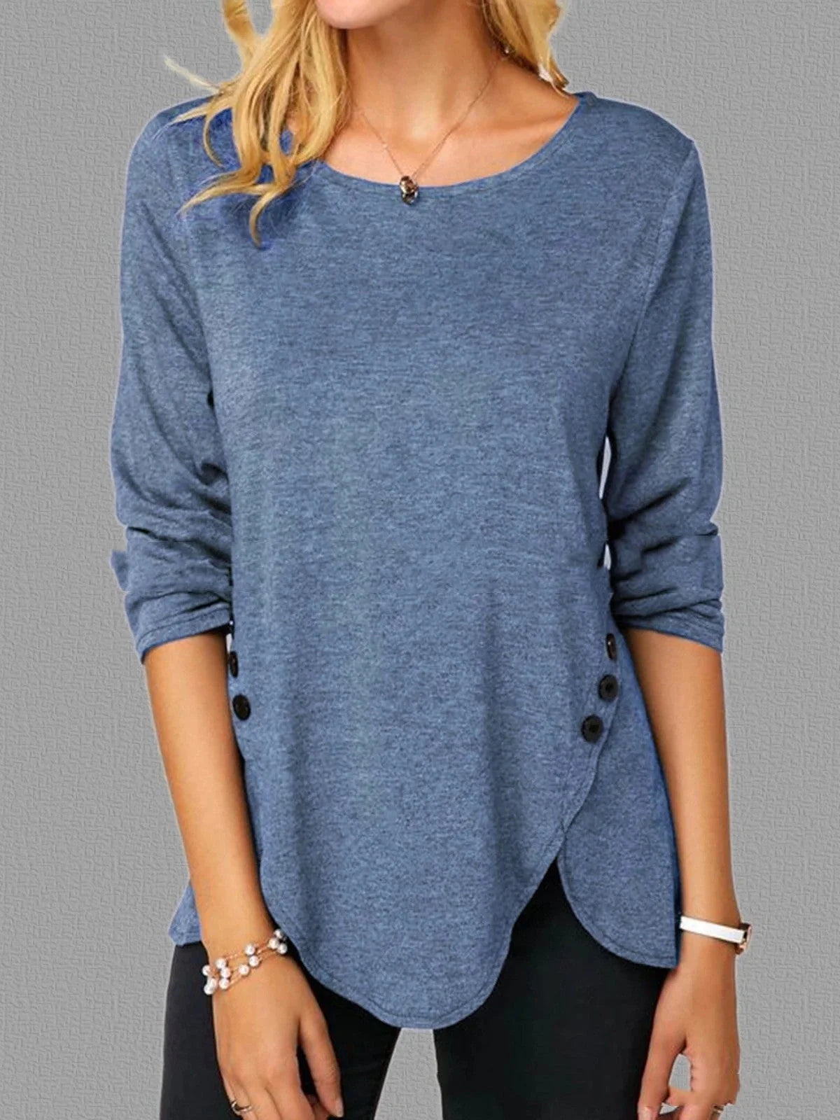 Oversized cotton t-shirt with irregular button hem in black, green, and blue colors