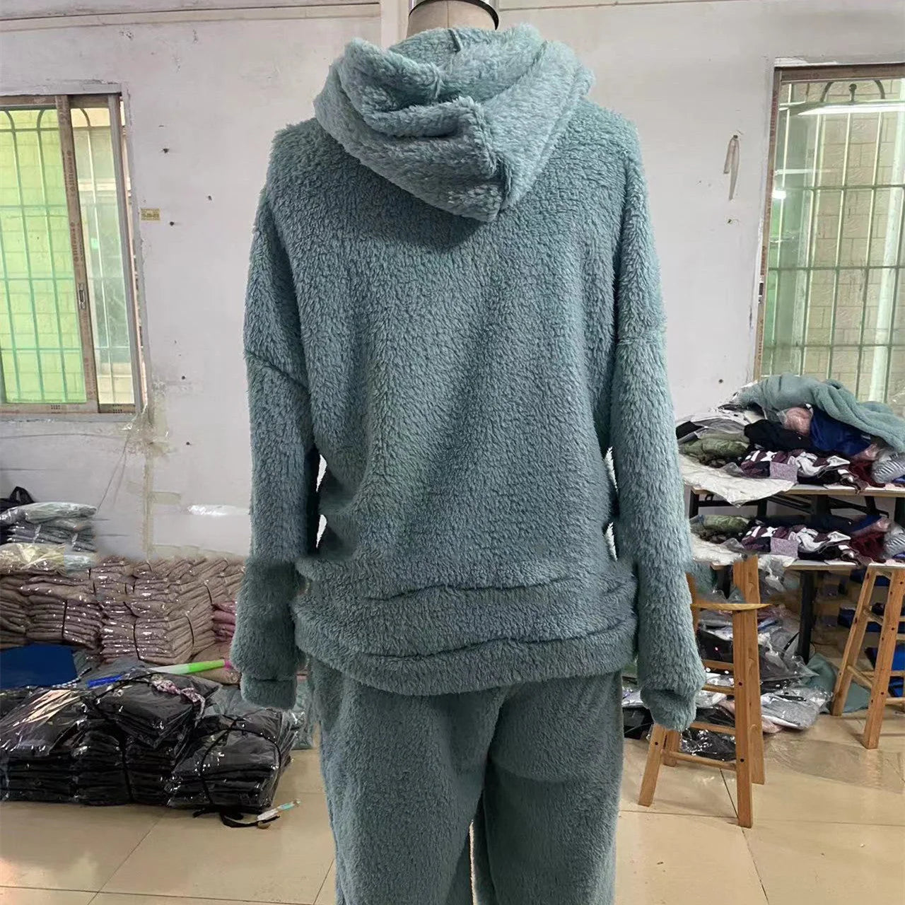 Fleece-lined hooded casual trousers in various colours, featuring dimensional patch pockets and a stylish, comfortable design.