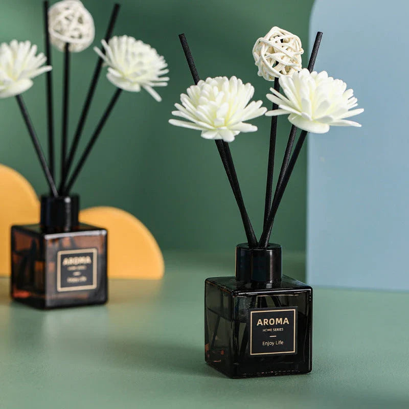 A luxurious jasmine reed diffuser set with a decorative plastic flower, designed to infuse your home with a captivating and calming fragrance.