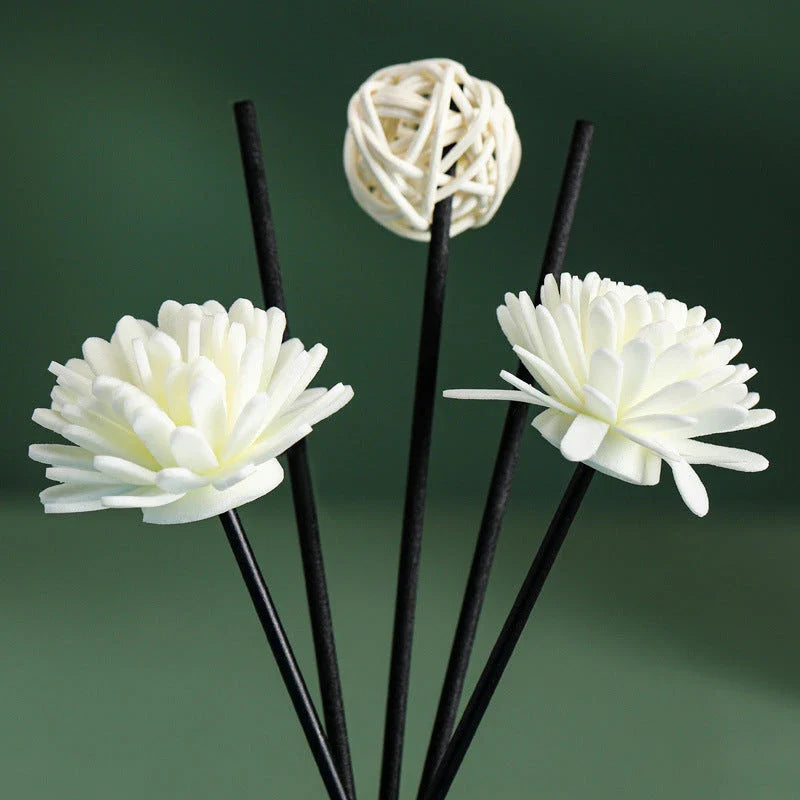 A luxurious jasmine reed diffuser set with a decorative plastic flower, designed to infuse your home with a captivating and calming fragrance.
