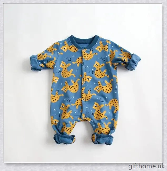 A cosy baby romper with charming cartoon designs, made from soft and breathable cotton fabric.