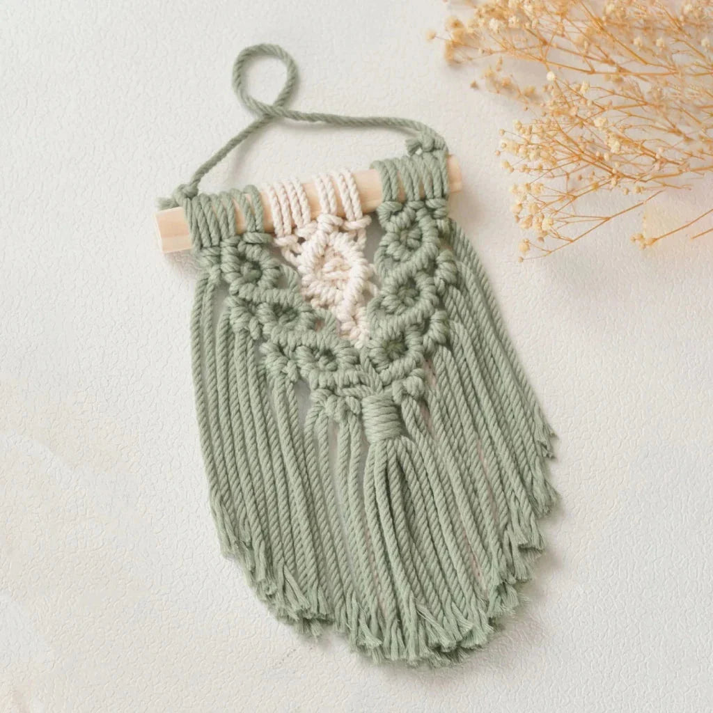 Handmade macrame wall hanging tapestry in creamy-white colour, featuring intricate patterns and natural textures