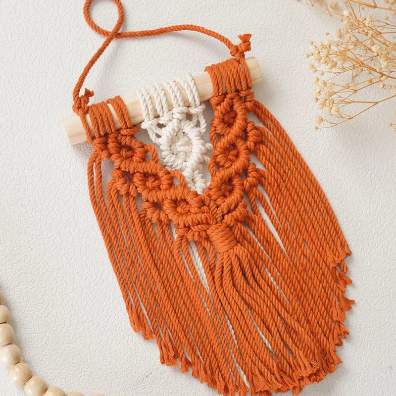 Handmade macrame wall hanging tapestry in creamy-white colour, featuring intricate patterns and natural textures