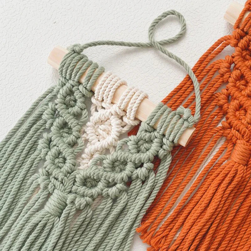 Handmade macrame wall hanging tapestry in creamy-white colour, featuring intricate patterns and natural textures