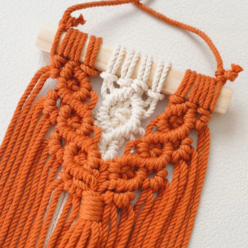 Handmade macrame wall hanging tapestry in creamy-white colour, featuring intricate patterns and natural textures