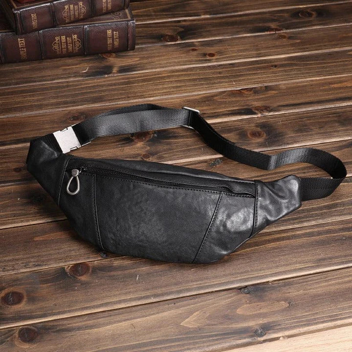 A premium black leather sports waist pack with multiple pockets and an adjustable strap for hands-free mobility and convenience.