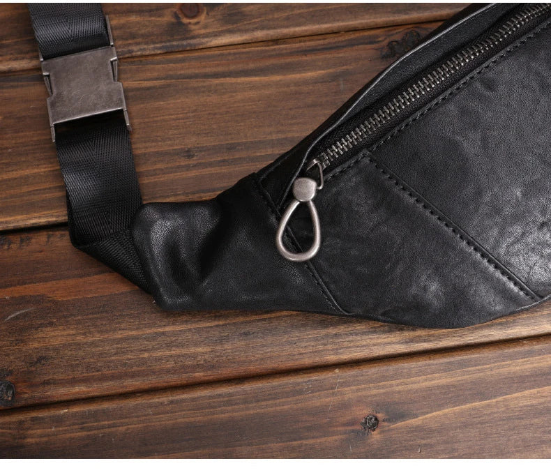 A premium black leather sports waist pack with multiple pockets and an adjustable strap for hands-free mobility and convenience.