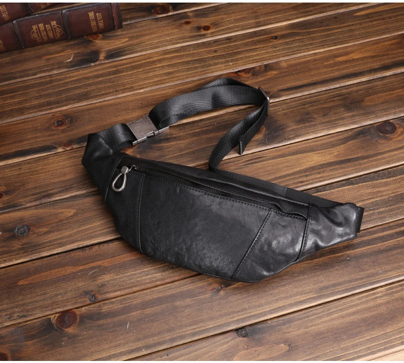 A premium black leather sports waist pack with multiple pockets and an adjustable strap for hands-free mobility and convenience.