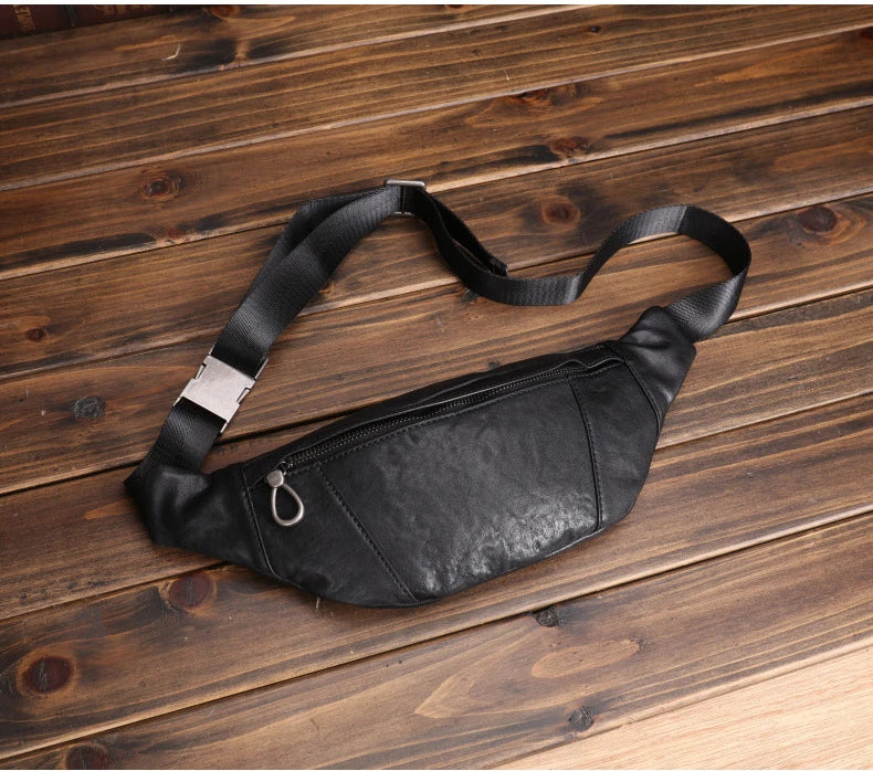 A premium black leather sports waist pack with multiple pockets and an adjustable strap for hands-free mobility and convenience.