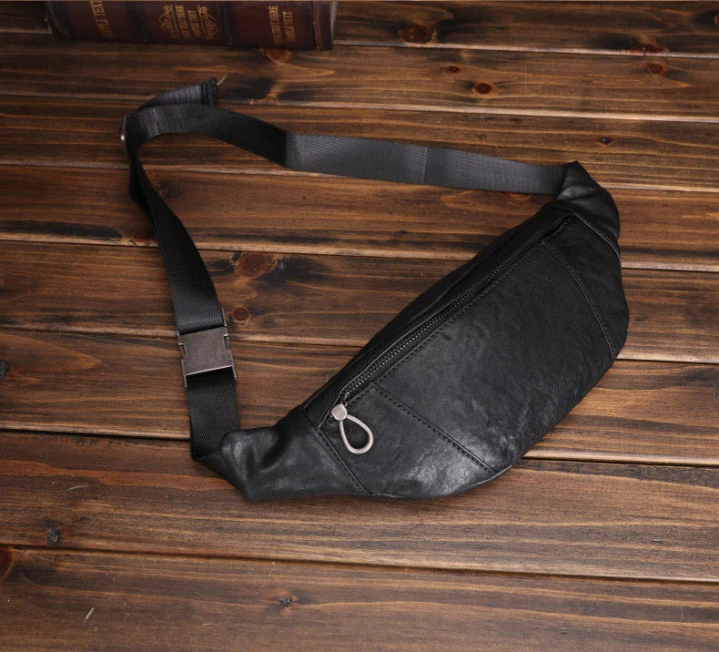 A premium black leather sports waist pack with multiple pockets and an adjustable strap for hands-free mobility and convenience.