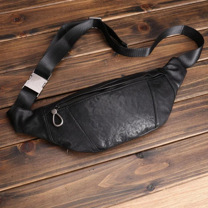 A premium black leather sports waist pack with multiple pockets and an adjustable strap for hands-free mobility and convenience.