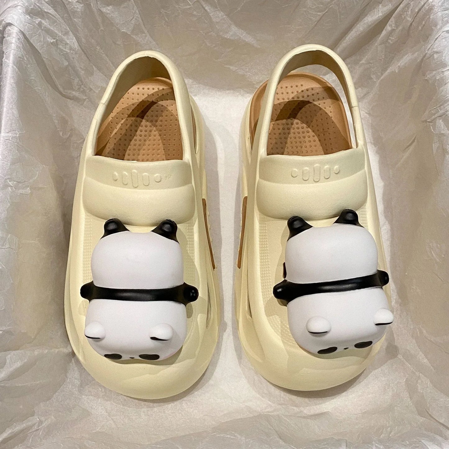 Adorable panda-themed slip-on slippers in various colors and sizes, featuring a lightweight and breathable design for comfortable everyday wear.