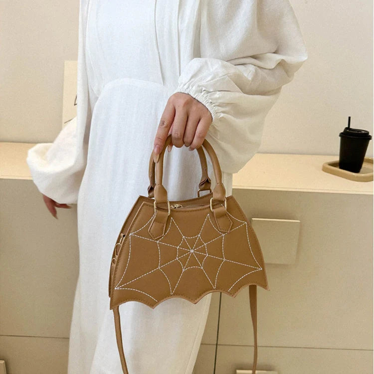 Trendy spider web-patterned shoulder bags in various colours, perfect for adding a spooky-chic touch to your Halloween outfit