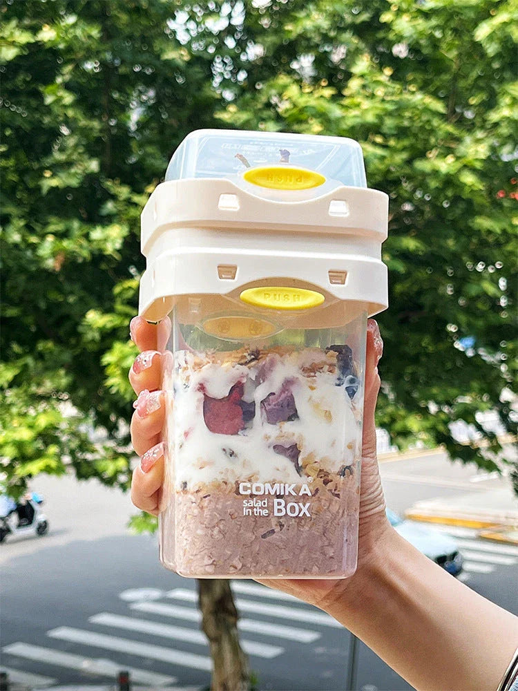 Dual-layer meal prep container with separate compartments and leak-proof lid, available in yellow and cream white colors