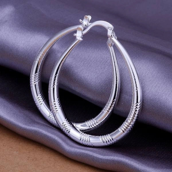 Stylish silver hoop earrings with a unique blend of European and American design, crafted from premium copper and 925 sterling silver plating
