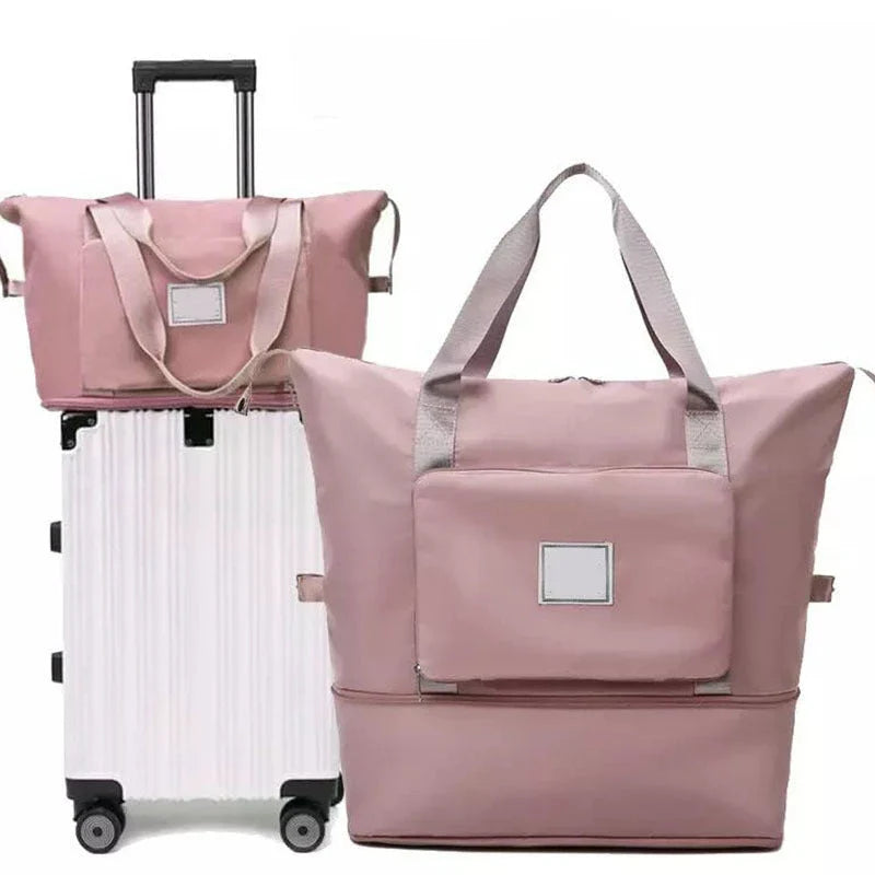 Expandable travel duffel bag with adjustable shoulder strap, multiple interior pockets, and water-resistant Oxford cloth material