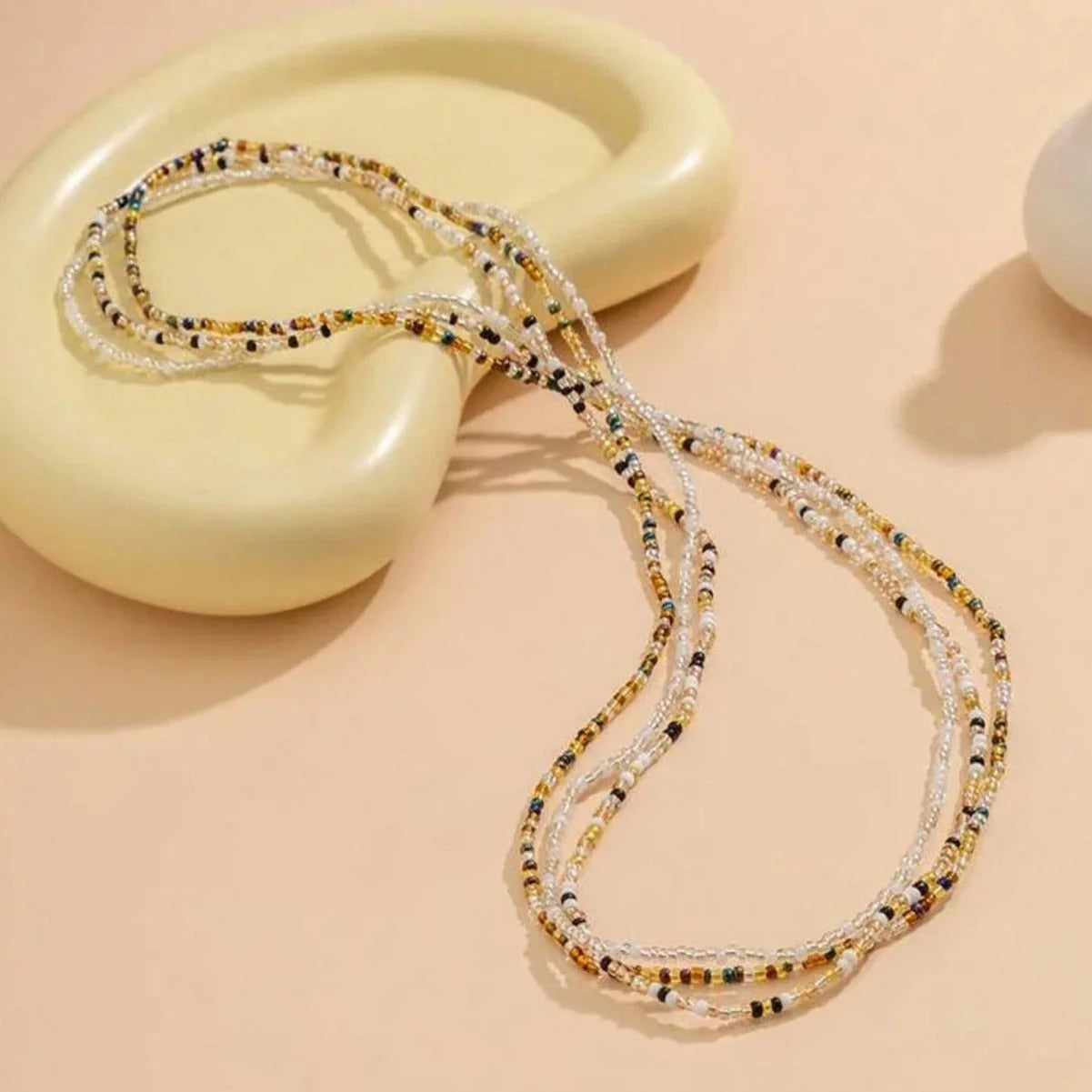 Stylish mixed colour beaded waist chain accessory for beach vacations and holidays