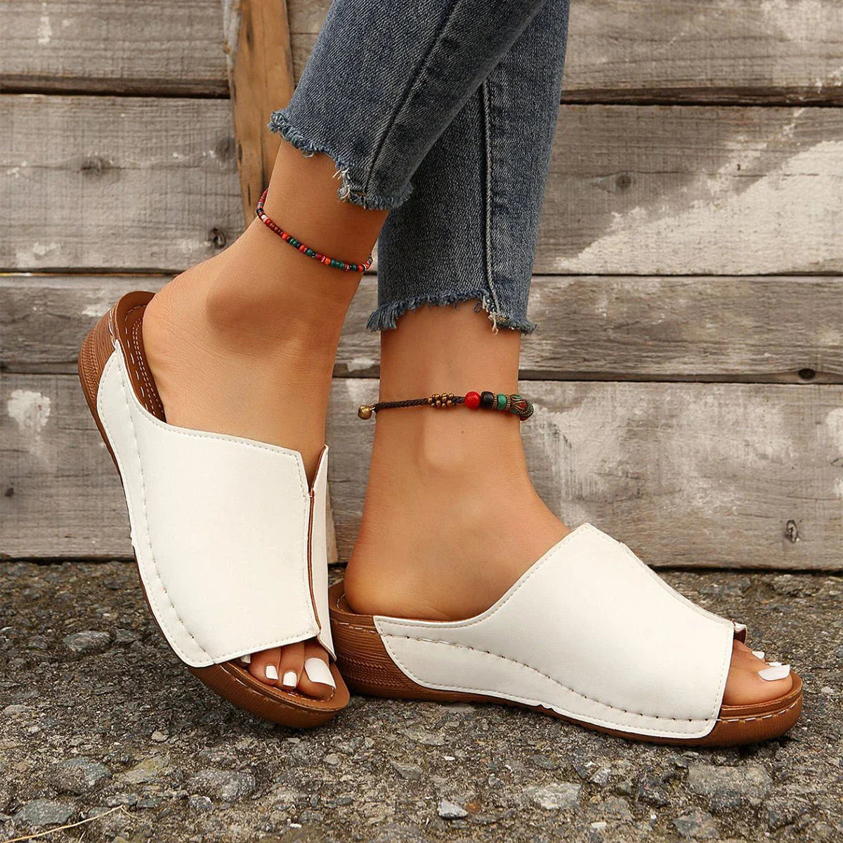 Fashionable wedge sandals in a variety of colors, featuring a peep-toe design and thick, durable soles for comfort and style