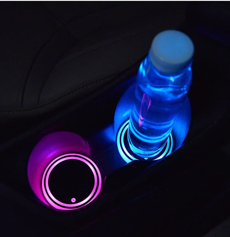 Colorful car cup holder with LED light-up coaster, solar and USB charging, and non-slip surface for ambient lighting in the car