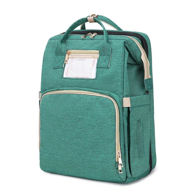 Portable folding crib and mummy bag in green and grey, compact design for baby travel