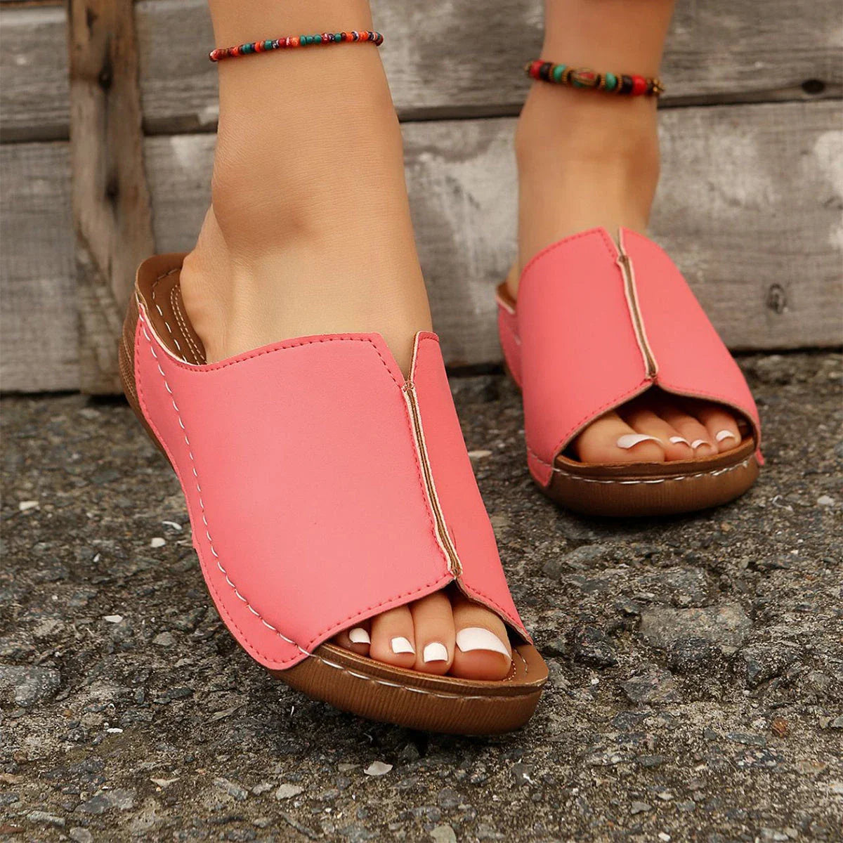 Fashionable wedge sandals in a variety of colors, featuring a peep-toe design and thick, durable soles for comfort and style