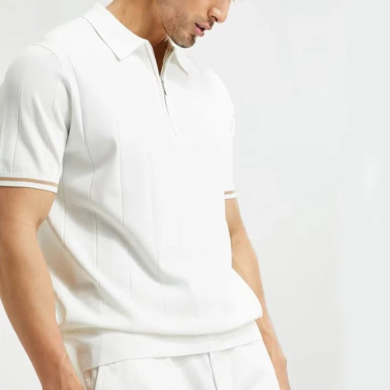 Short-sleeved polo shirt with zipper collar, available in white and dark blue colours, suitable for British summer style.