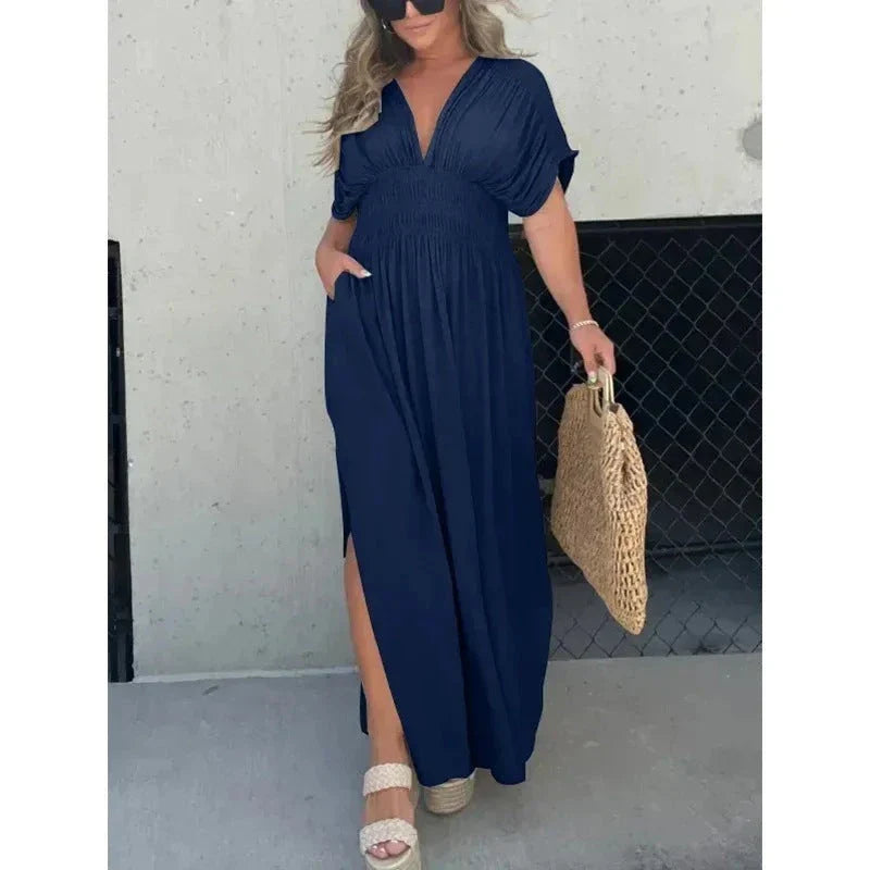 Chic bat-sleeve dress with v-neck, side slit, and elastic waist for comfortable summer style