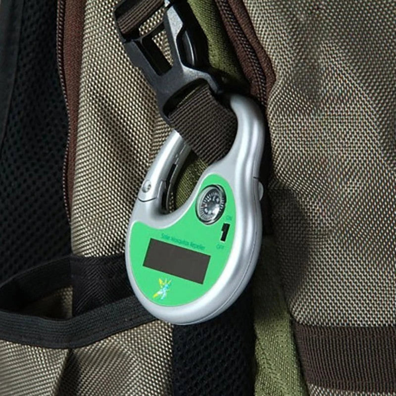 A compact, solar-powered ultrasonic mosquito repellent device with a green housing and solar panel