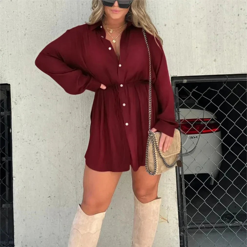 Women's long sleeve jumpsuit with button accents in various vibrant colors