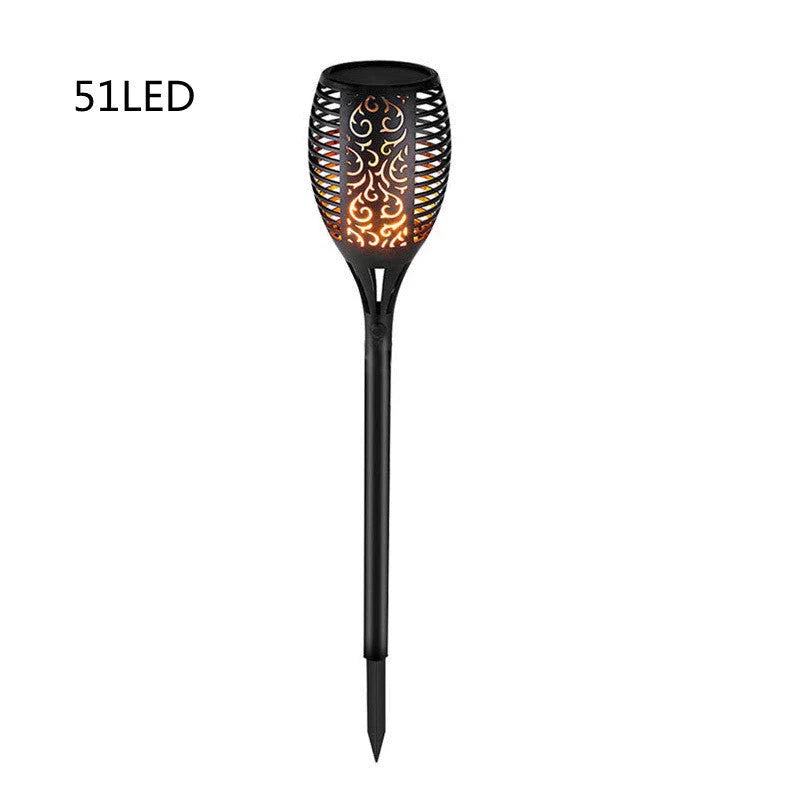 Elegant solar-powered garden lights illuminating a pathway in a lush British garden