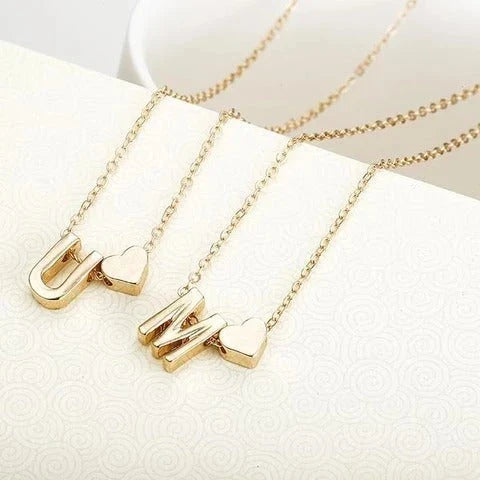 Heart-shaped pendant necklace with adjustable chain in various metallic finishes