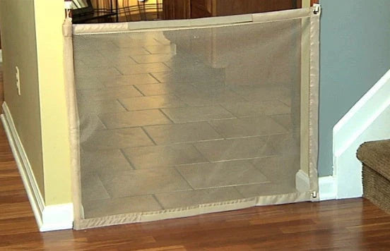 Versatile foldable pet safety barrier made of durable mesh fabric and stainless steel for use in doorways, walls, and stairs