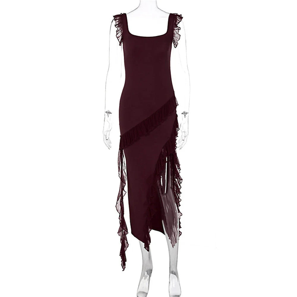 Elegant satin slip dress with ruffle detailing and thigh-high slit, available in various colours and sizes.