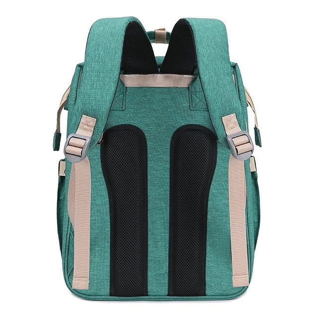 Portable folding crib and mummy bag in green and grey, compact design for baby travel