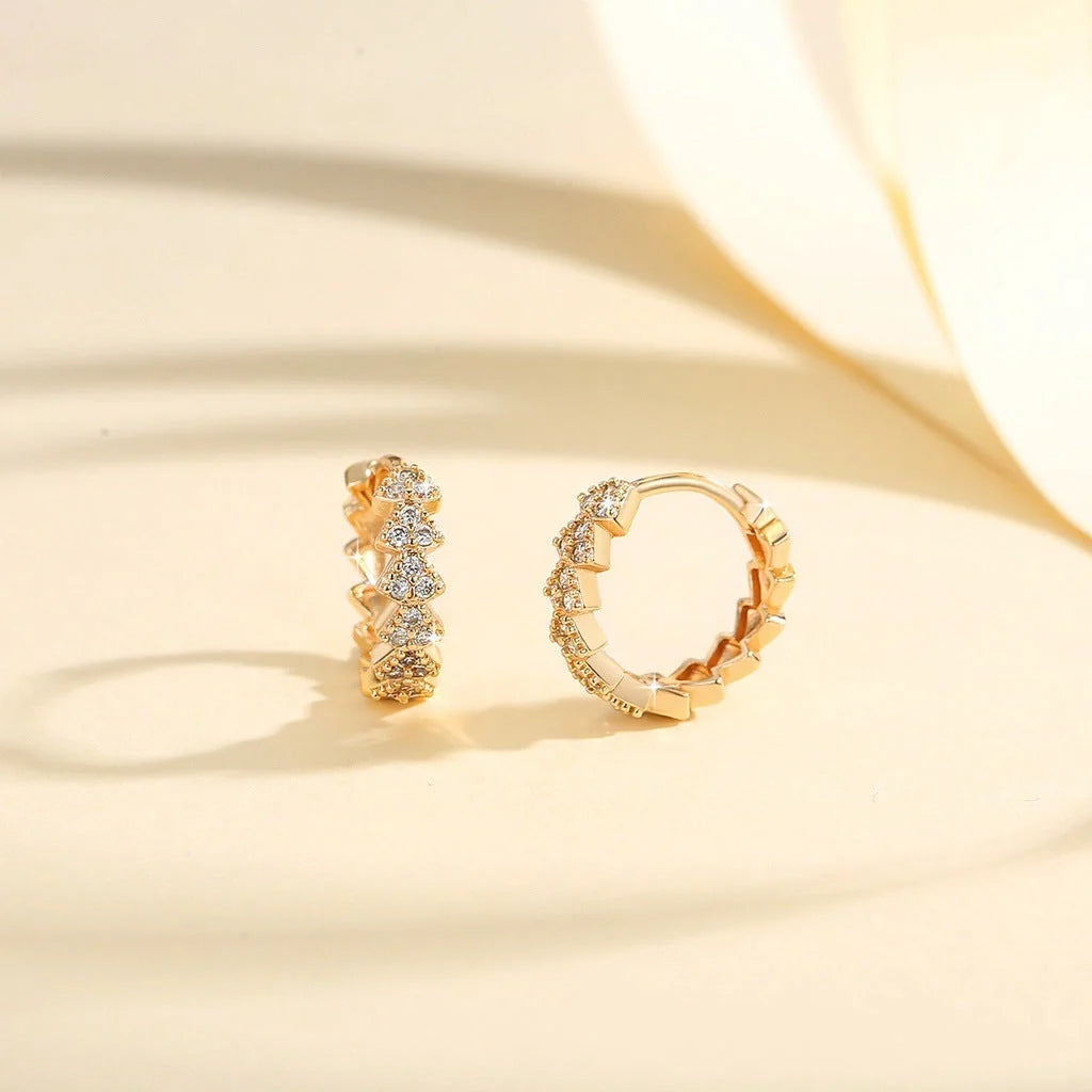 Premium copper-plated gold and zircon stud earrings in a classic design, exuding British elegance and sophistication