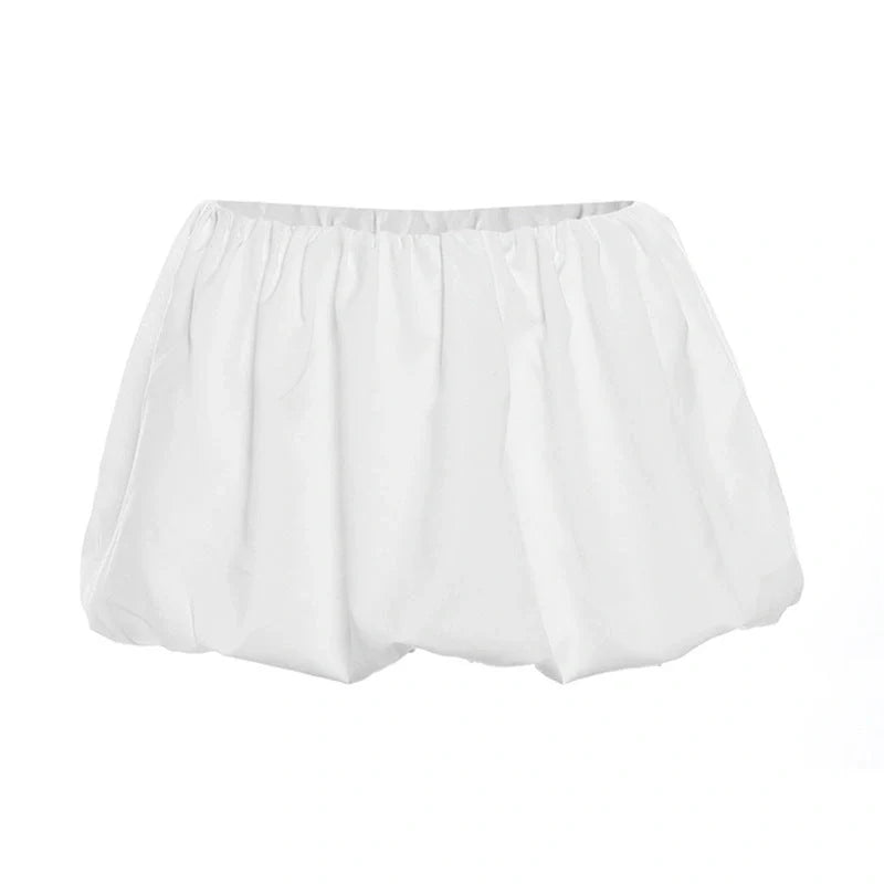 Fashionable two-piece set featuring a tailored top with V-neck and long sleeves, and a chic mini skirt. Available in white and black colours.