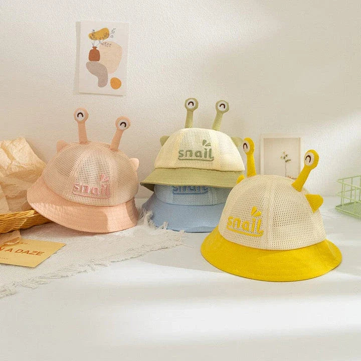 A blue cotton baby bucket hat with a solid colour design to protect your child from harmful UV rays.