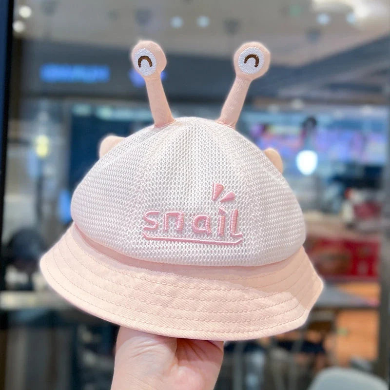 A blue cotton baby bucket hat with a solid colour design to protect your child from harmful UV rays.