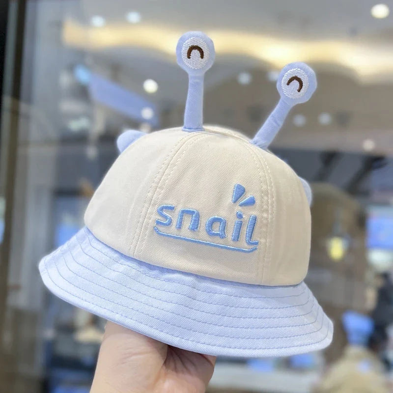 A blue cotton baby bucket hat with a solid colour design to protect your child from harmful UV rays.