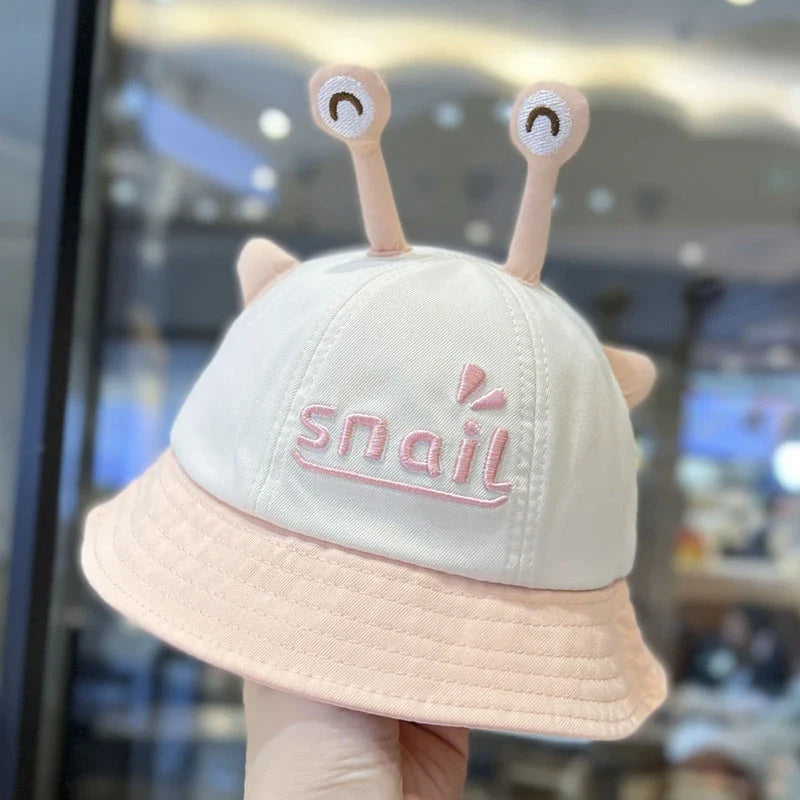A blue cotton baby bucket hat with a solid colour design to protect your child from harmful UV rays.