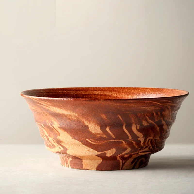 Stylish red ceramic salad bowl with generous capacity for serving a variety of dishes