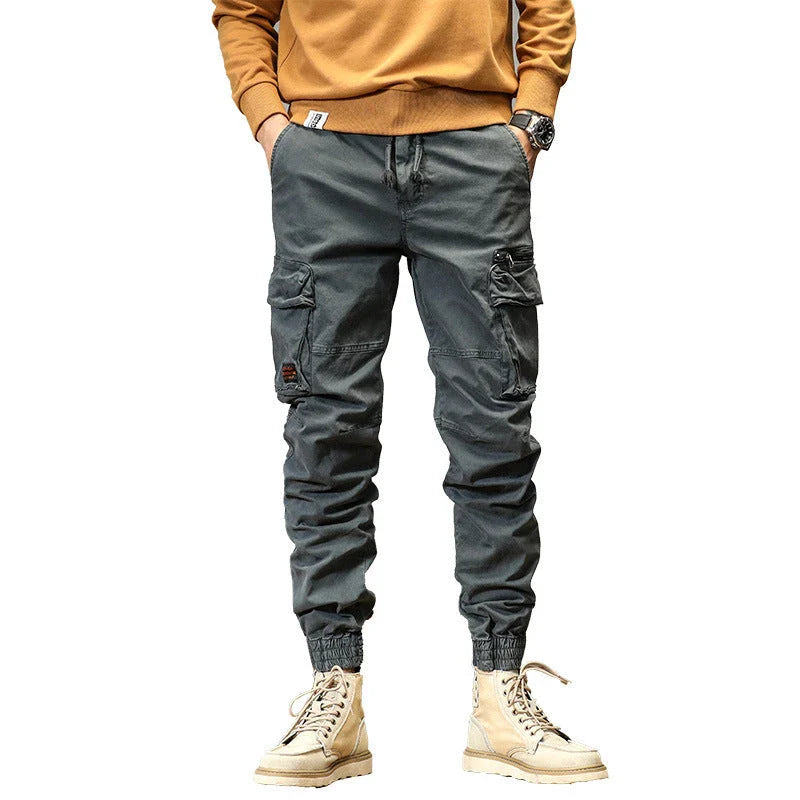 American Straight Multi-pocket Lace Trousers in gray, featuring premium cotton construction and subtle lace accents for a refined British-inspired look.