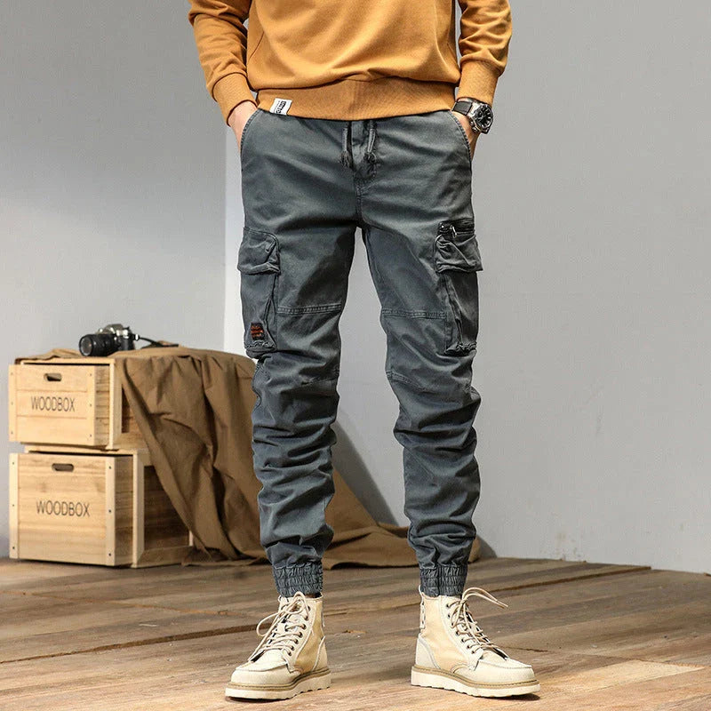 American Straight Multi-pocket Lace Trousers in gray, featuring premium cotton construction and subtle lace accents for a refined British-inspired look.