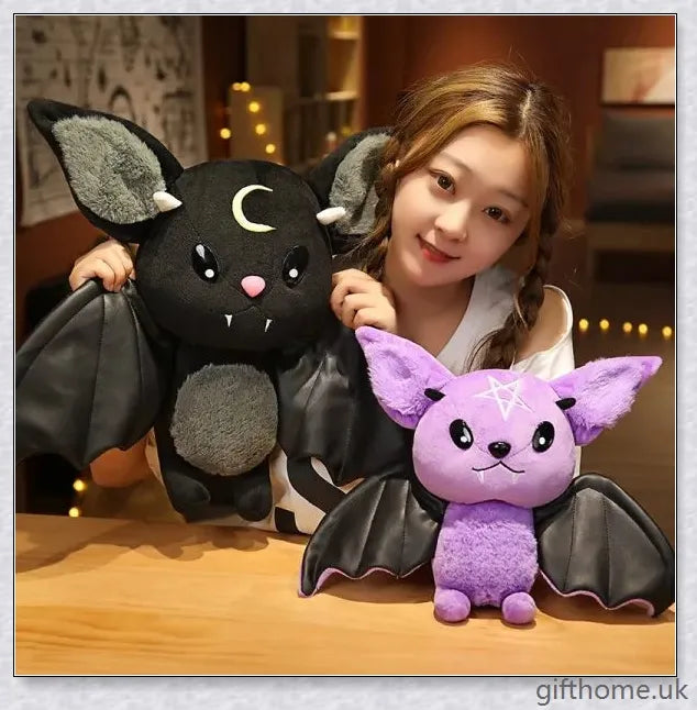 Soft, plush bat toy in purple and black colours, perfect for cuddling or decoration