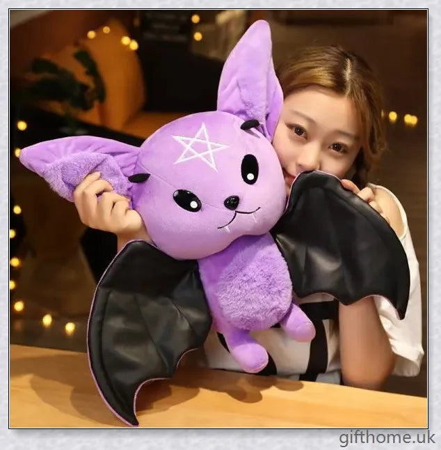 Soft, plush bat toy in purple and black colours, perfect for cuddling or decoration
