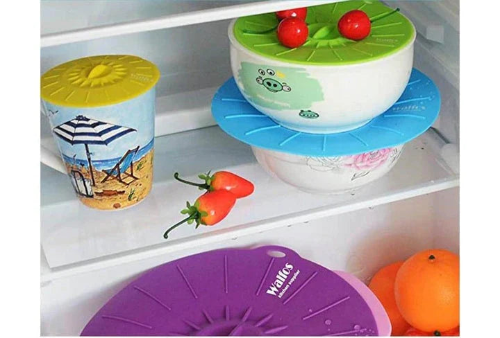 A set of multifunction silicone lids in various sizes, designed to fit a variety of pots, pans, and bowls for versatile kitchen use.