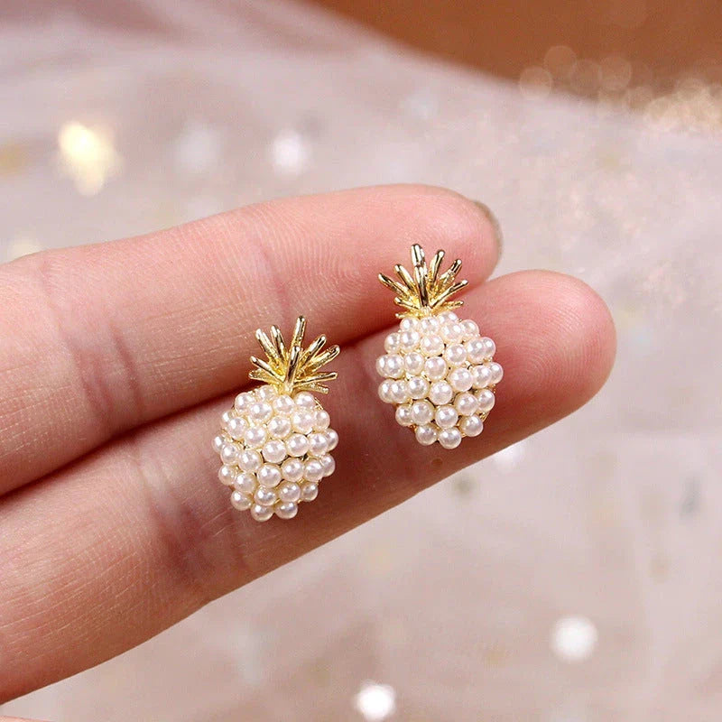 Elegant pearl pineapple stud earrings for women in a white and gold colour scheme