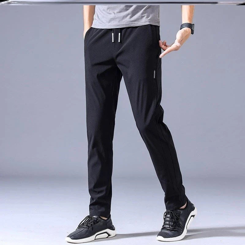 Premium Korean-style drawstring trousers in black, khaki, and dark grey colours, featuring a relaxed, straight-leg silhouette and micro-elastic fabric for comfort and flexibility.